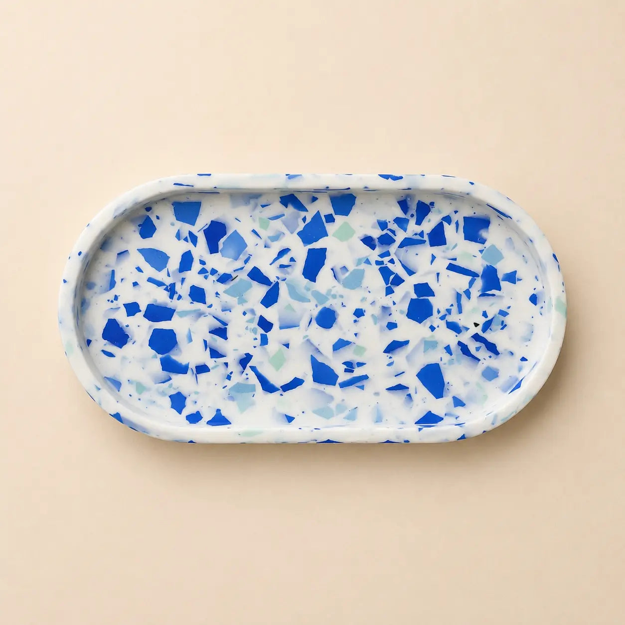 Blue terrazzo oval decorative tray with white base and blue chips