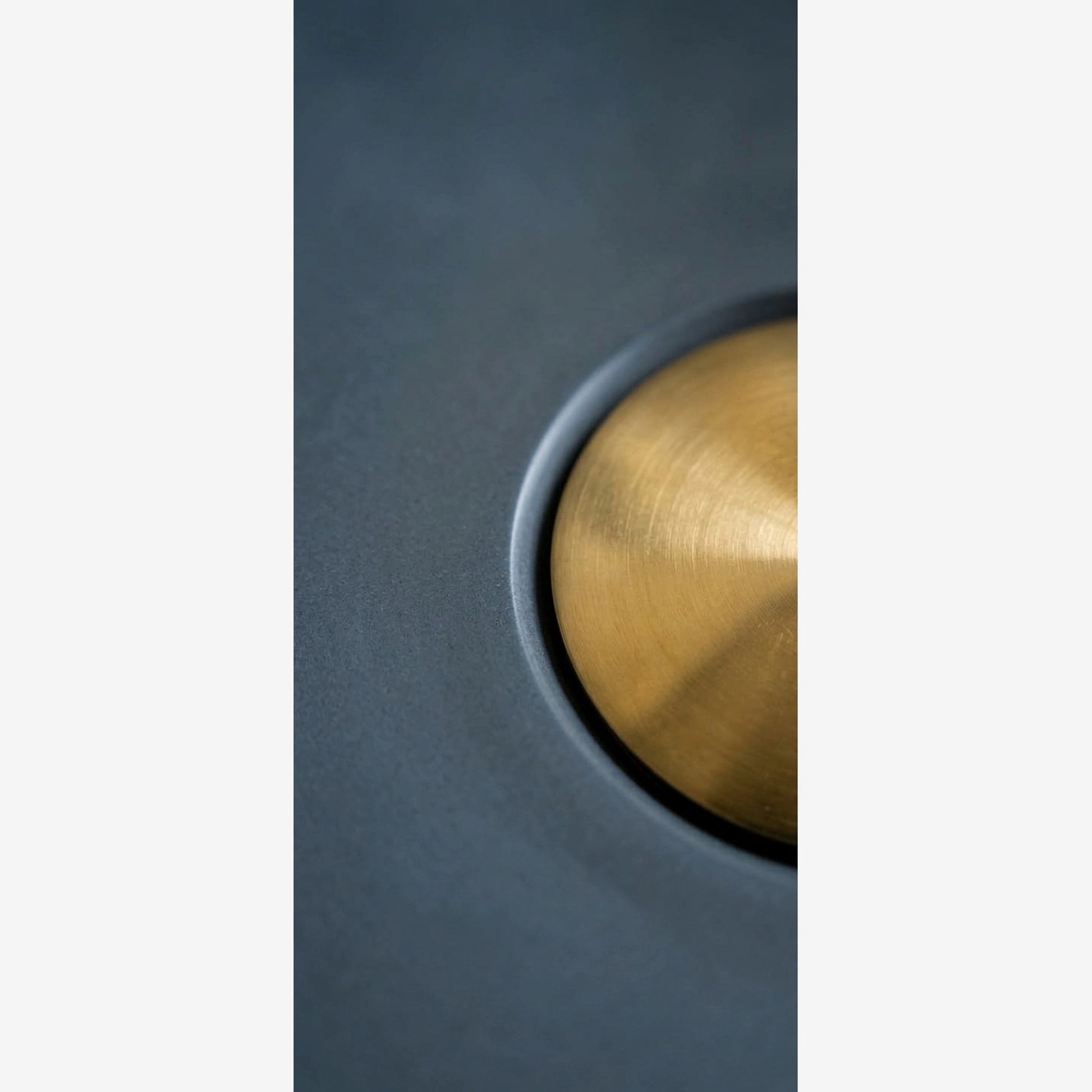 Concrete stone vessel sink texture close-up showing handmade surface detail and matte finish