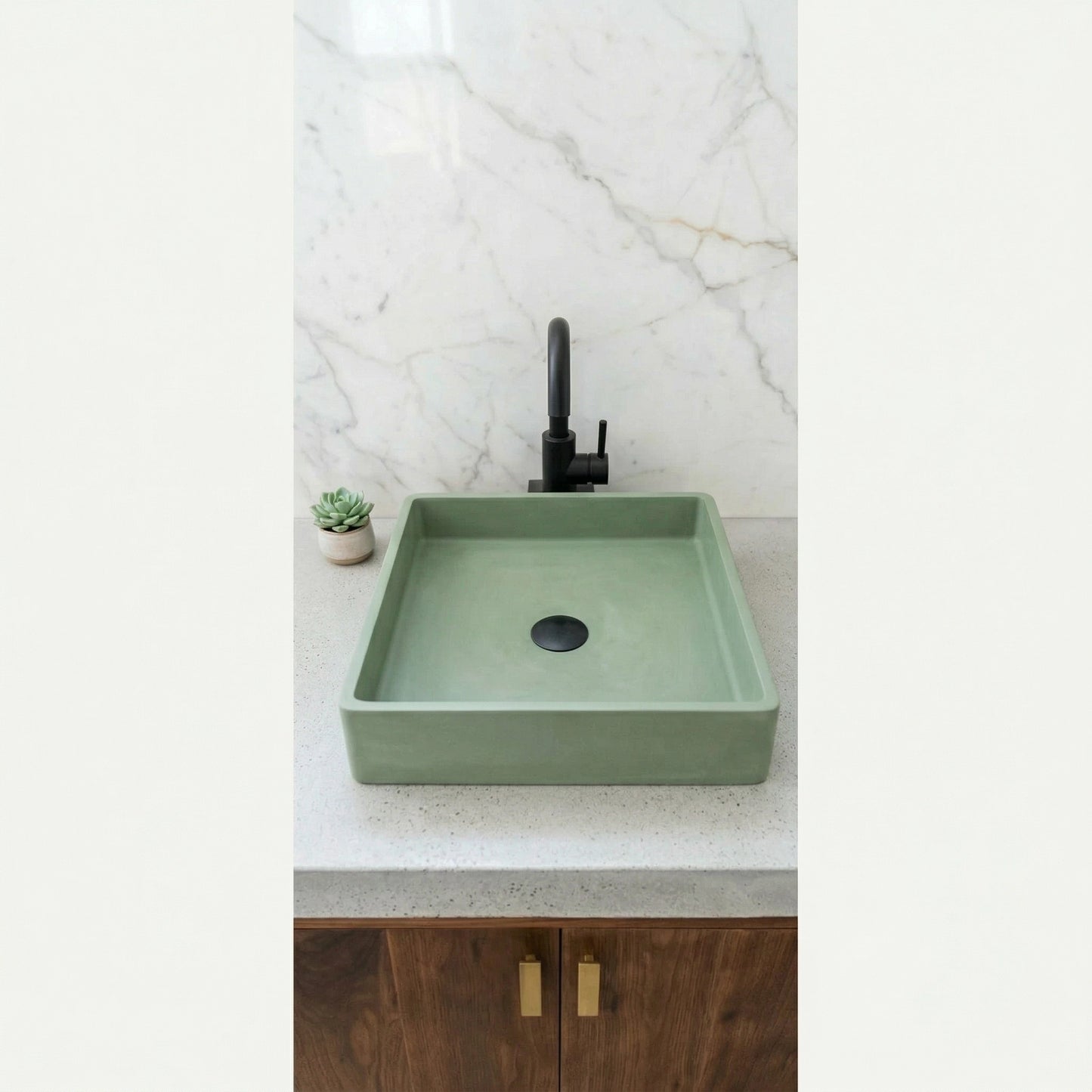 Sage green square vessel sink made from stone composite on modern bathroom vanity